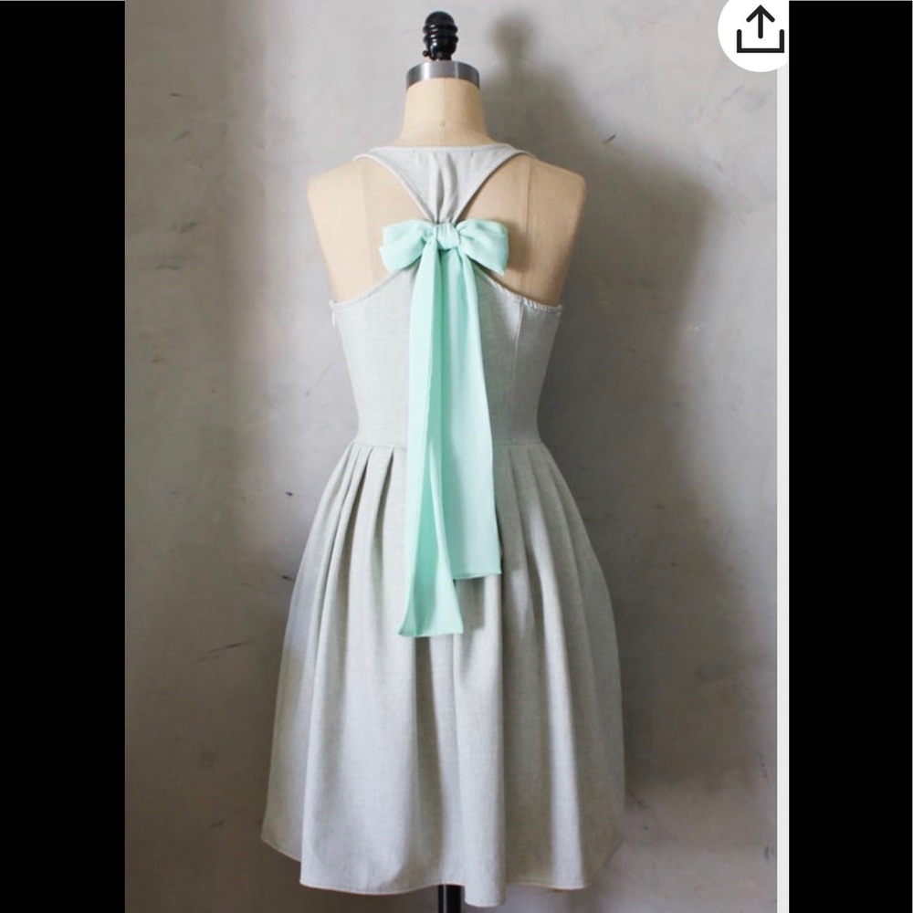 Heather green linen dress with pockets, pastel mint chiffon bow & pleated skirt.